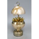 A novelty gilt metal globe musical cigarette holder, height 18cm