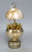 A novelty gilt metal globe musical cigarette holder, height 18cm