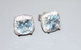 A pair of modern 14k white metal, aquamarine and diamond cluster ear studs, 10mm, gross 3 grams.