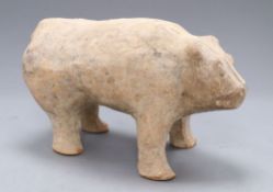 A Chinese pottery figure of a bear, Han dynasty or later, length 33cm