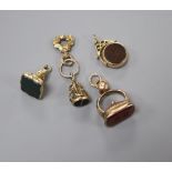 Four assorted 19th century and later yellow metal or gold plated hardstone set fob seal and one