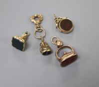 Four assorted 19th century and later yellow metal or gold plated hardstone set fob seal and one