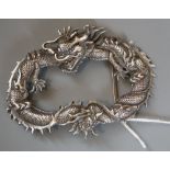 A Chinese white metal dragon buckle?, unmarked, 96mm, 49.1 grams.CONDITION: Good condition.