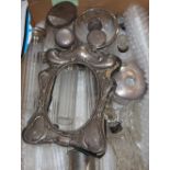 Thirteen silver mounted toilet jars etc. a modern silver mounted photograph frame and other jars.