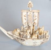 A Japanese marine ivory carving of the treasure ship and passengers, early 20th century, L. 19.5cm