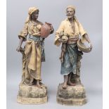 A pair of Austrian earthenware figures of street vendors, by Johann Maresch, height 48cm