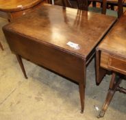 A Georgian mahogany Pembroke table on tapered legs with brass castors, W.79cm, D.53cm, H.