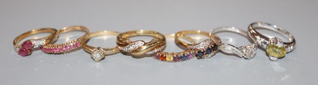 Eight assorted modern 9ct gold and gem set dress rings including diamonds and two white gold,