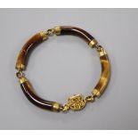 A Chinese 14k and tiger's eye quartz link bracelet (one link cracked and glued), gross 22.4 grams.