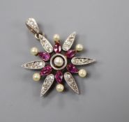 A late Victorian yellow metal, ruby, diamond and seed pearl set starburst pendant brooch, with