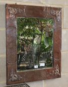 An Arts and Crafts rectangular copper framed wall mirror, W.56cm, H.69cm