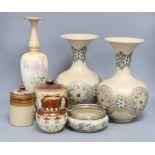 Seven pieces of Doulton stoneware including a glazed chrysanthemum vase, height 34cm