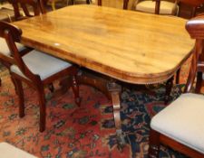 A Regency rectangular rosewood tilt top dining table, W.140cm, D.96cm, H.70cmCONDITION: The top is