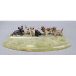 A cold painted bronze dish, modelled with terriers and a spaniel, length 36cm