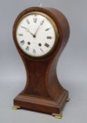 A mahogany balloon cased clock, with French movement, height 40cm