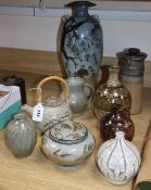 Seven Studio pottery vessels, including a Roger Cockram bottle vase, 22cm and a teapot marked 'JM'