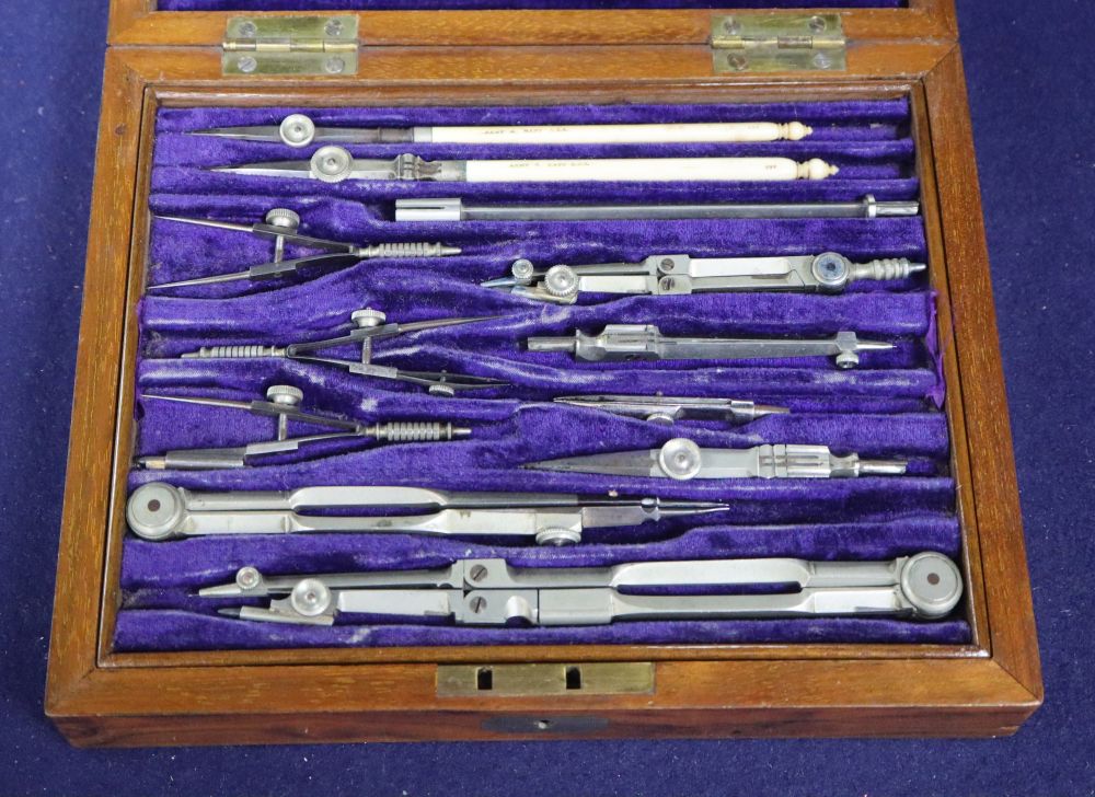 A Victorian Army and Navy set of draughtsman instruments and rules, walnut cased