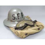 A World War II Zuckermann civil defence helmet, a case and goggles