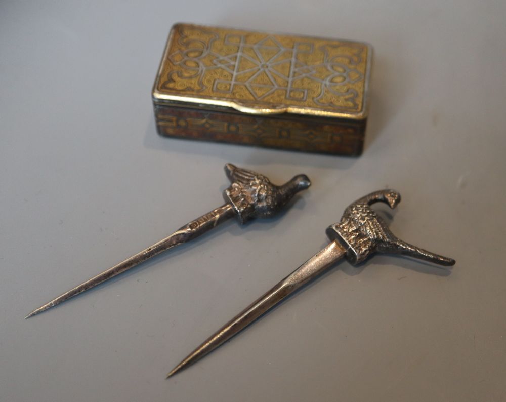 A 19th century damascened iron vesta case and two 'bird' skewers