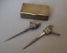 A 19th century damascened iron vesta case and two 'bird' skewers