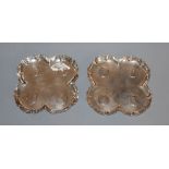 A pair of Victorian silver coin inset quatrefoil dishes, F.B. Thomas & Co, London, 1888, 11cm, gross