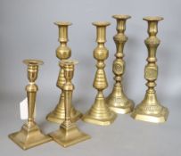 Three pairs of 19th century brass candlesticks, tallest 28cm