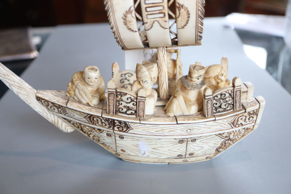 A Japanese marine ivory carving of the treasure ship and passengers, early 20th century, L. 19.5cm - Image 2 of 2