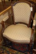 A pair of French walnut fauteuils