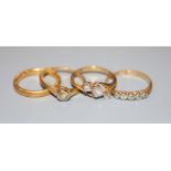 A 22ct gold wedding ring, 4.4 grams and three 18ct gold diamond-set rings, gross 5.9 grams.