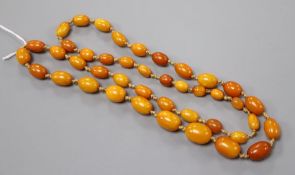 A single strand graduated oval amber bead necklace, 84cm, gross 40 grams.CONDITION: No damage to the