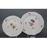 A set of eight Berlin plates, decorated with butterflies and flowers, diameter 21cm (5) and 24cm (