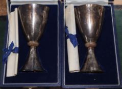 A pair of cased limited edition silver QEII Silver Wedding Commemorative goblets, Mappin & Webb,