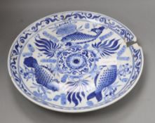 A Chinese blue and white 'fish' dish, diameter 36cm (a.f.)CONDITION: Broken into several pieces