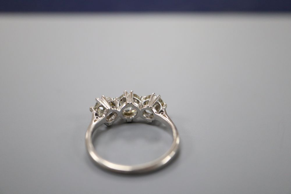 A platinum and three stone diamond ring, size N, gross 4.1 grams.CONDITION: Central stone approx. - Image 3 of 3