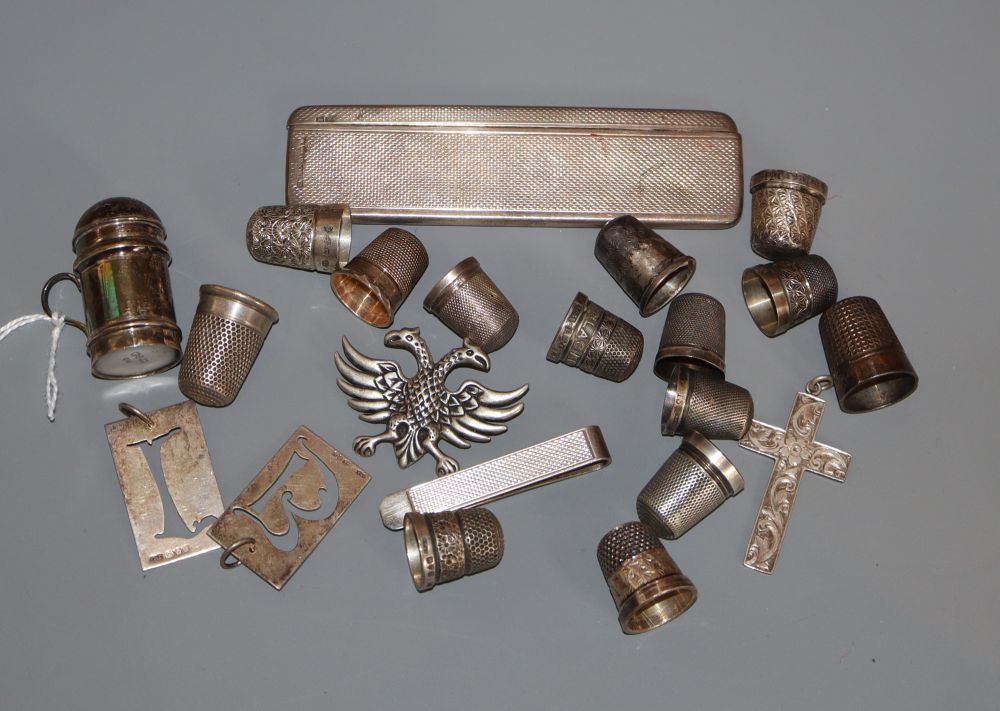 A group of silver thimbles, an engine turned silver comb and case, etc.