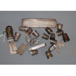 A group of silver thimbles, an engine turned silver comb and case, etc.