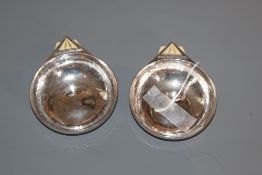 A pair of Art Deco ivory mounted planished silver circular dishes, with lug handle, Robert Edgar