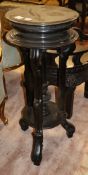 A late Victorian ebonised jardinere stand, 38cm diameter, H.92cm