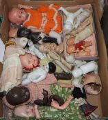 A quantity of miniature dolls, porcelain, bisque and plastic together. A collection of modern Kewpie