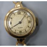 A lady's 1950's 9ct gold Zenith manual wind wrist watch, with case back inscription, on a 9ct