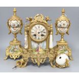 A French gilt metal and porcelain clock garniture, height 32cm