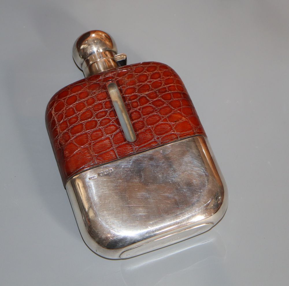 A George V silver and leather mounted glass hip flask, James Dixon & Sons, Sheffield, 1924, 16.8cm.