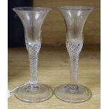 A pair of Georgian wine glasses, each with trumpet bowl, air twist stem and folded foot, height
