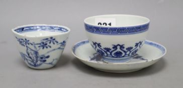 Two Chinese blue and white cups and a saucer, one with reign markCONDITION: The smaller of the two