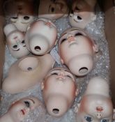 Ten modern dolls heads and ten others