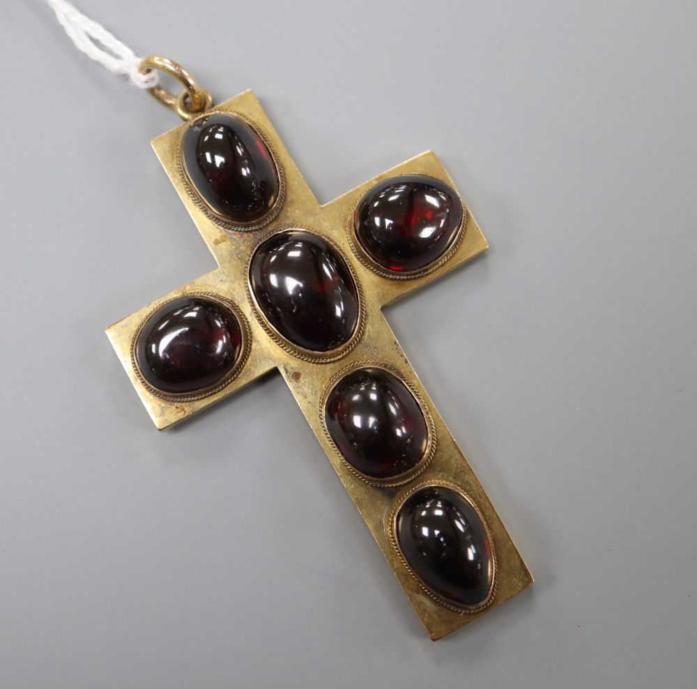 A late 19th century yellow metal and six stone cabochon garnet set cross pendant, 6cm, gross 15.4