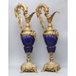 A pair of Louis XIV style gilt metal and porcelain ewers, height 62cm