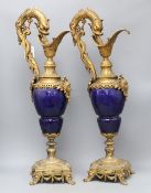 A pair of Louis XIV style gilt metal and porcelain ewers, height 62cm