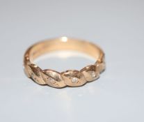 A modern 9ct gold and diamond chip set ring, size N, gross 2.6 grams.