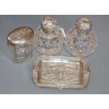 A pair of Edwardian repousse silver mounted cut glass scent bottles, Birmingham, 1905, 11.8cm, a